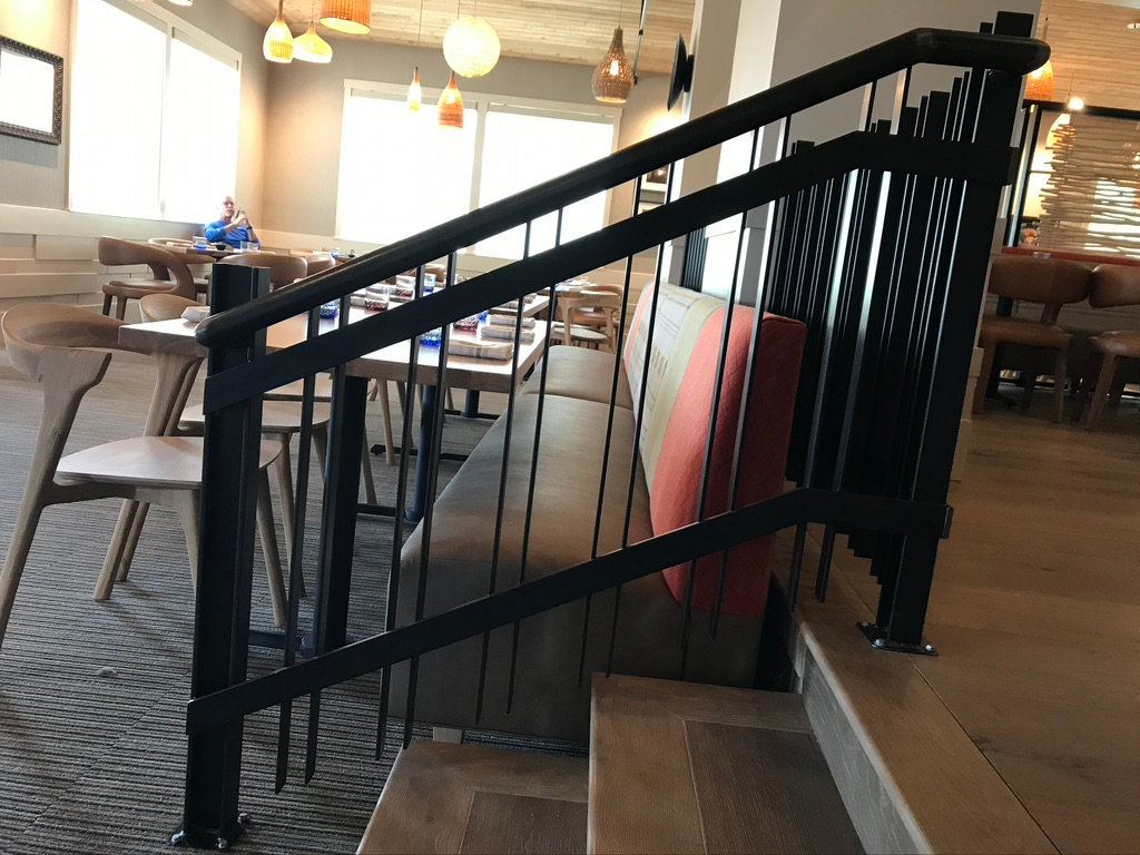 Black steel stair railing in a restaurant