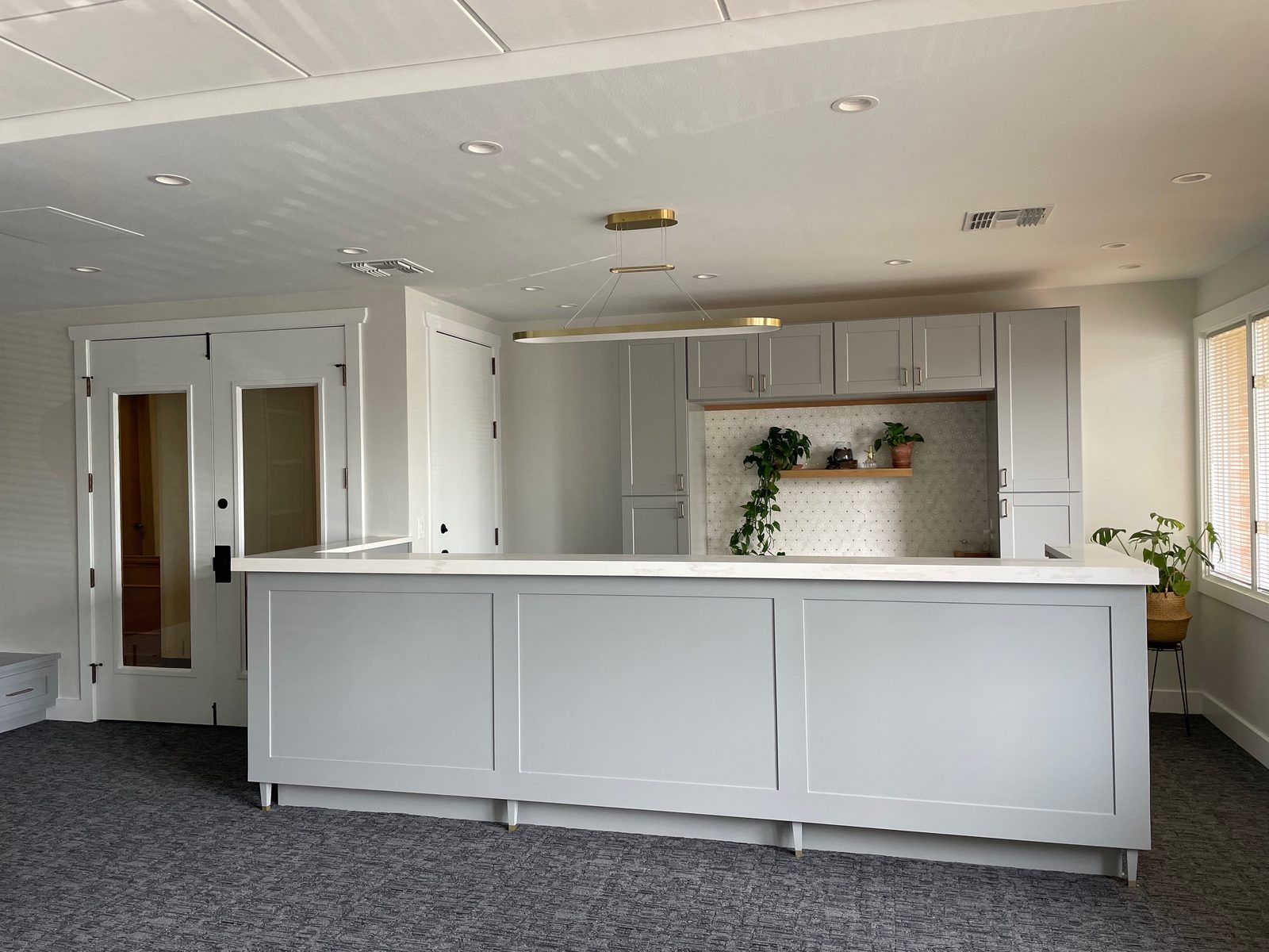Bright finished commercial interior with a white service counter