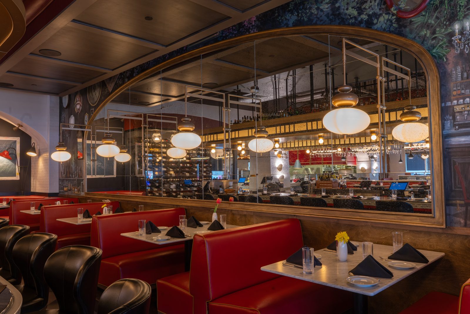 Red leather booths in a long dining room