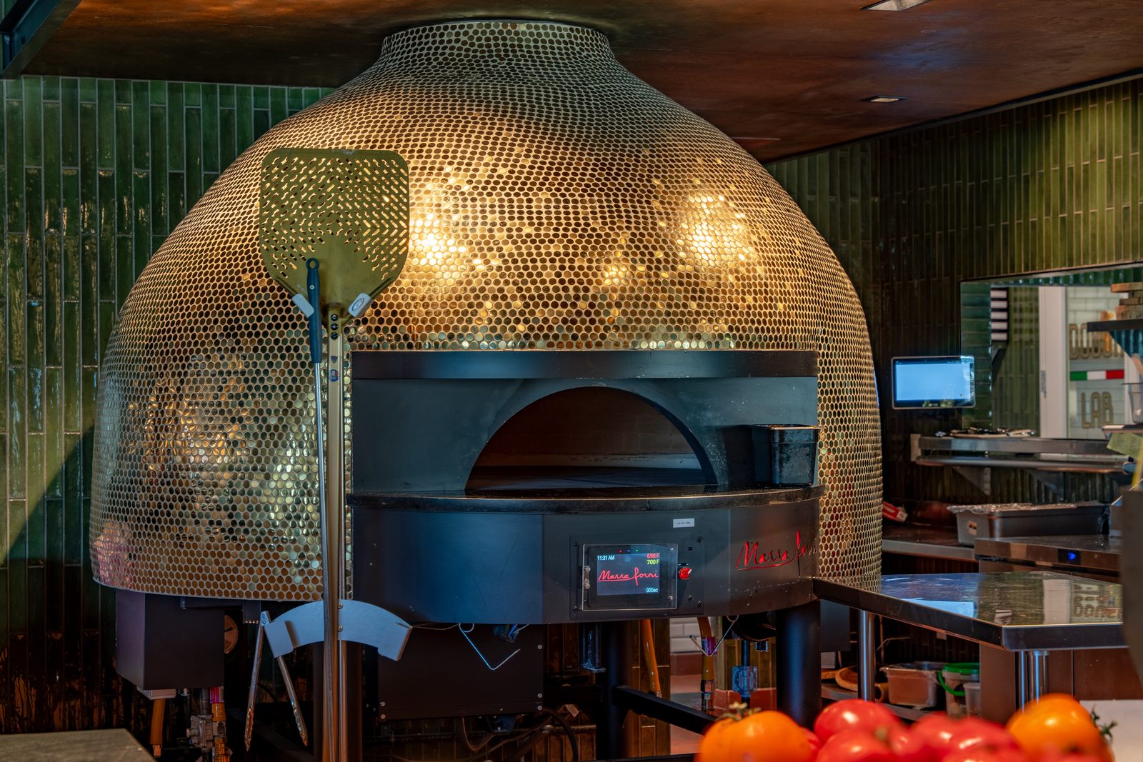 Mosaic-tiled wood-fired pizza oven